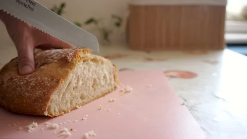 Cutting bread in a vintage kitchen Video stock 157024949