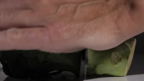 Cutting Broccoli In Half, Slow Motion Stock Footage 220755384