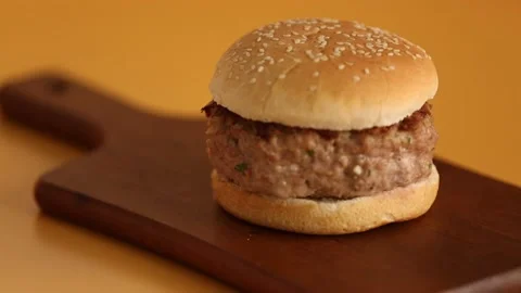 Cutting burger in halfs 1 Stock Footage 132204400