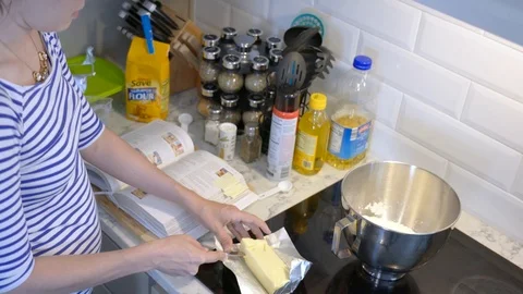 Cutting butter and adding to mixer Stock Footage 93619021