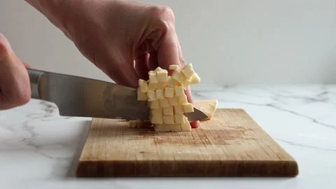 Cutting butter Stockbeeldmateriaal 234439363