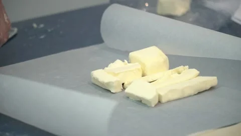 Cutting Butter in the Kitchen Stock Footage 317472582