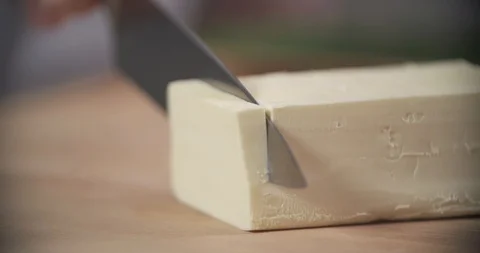Cutting butter in slow motion Stock Footage 91905571