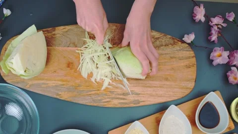 Cutting cabbage on a cutting board Stock Footage 252240408