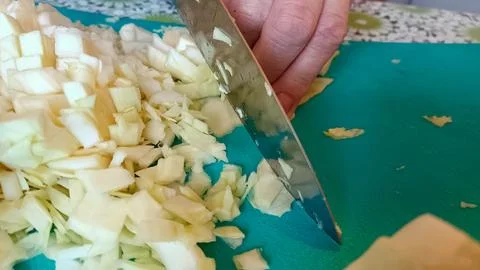 Cutting cabbage with a kitchen knife for preparing dinner Stock Photos