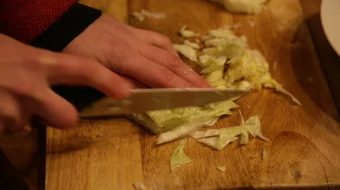 Cutting cabbage with a knife Stock Footage 60657444
