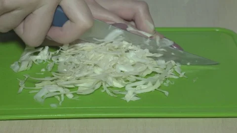 Cutting cabbage with a knife Stock Footage 83624529