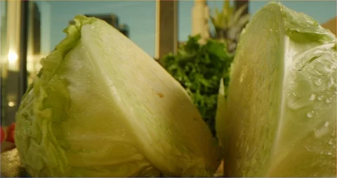 Cutting cabbage macro shot, pushing out from cabbage halfs Stock Footage 126301797