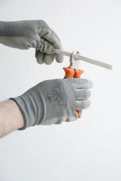 Cutting cable Stock Photos