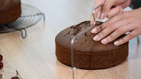 Cutting Cake on Layers. Making Chocolate Layer Cake. Stock Footage 99866307