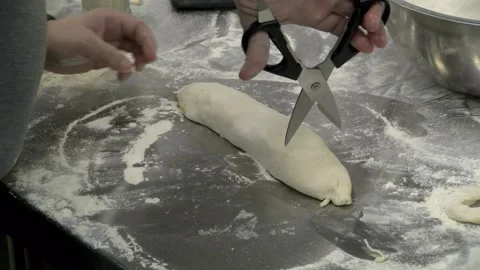 Cutting Calzone Dough with scissors Stock Footage 131985639