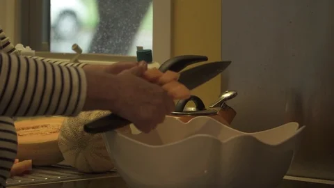 CUTTING CANTALOPE CLOSE up Video stock 102401422