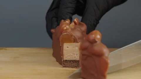 Cutting Caramel and Hazelnut Cheesecake with Kitchen Knife Stock Footage 342038174