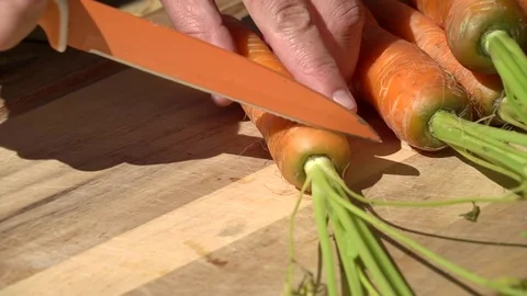 Cutting carrot Stock Footage 77961171