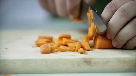 Cutting carrot with kitchen knife Stock Footage 32481781
