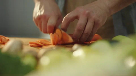 Cutting a carrot with sharp knife Stock Footage 311835237