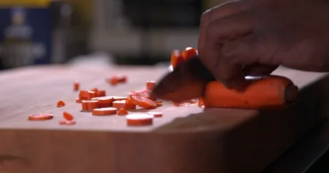 Cutting a carrot in slow motion 2 Stock Footage 87846441