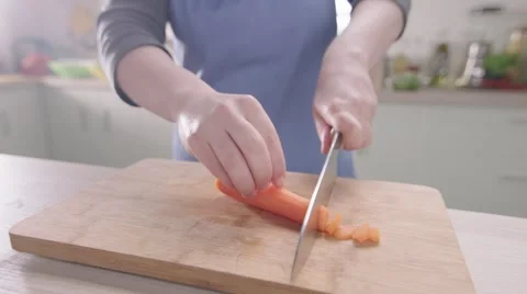 Cutting carrots 200fps slow motion Video stock 46491383