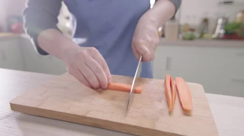 Cutting carrots 200fps slow motion Stock Footage 46491964