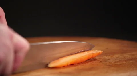 Cutting carrots on a kitchen board Video stock 60698530