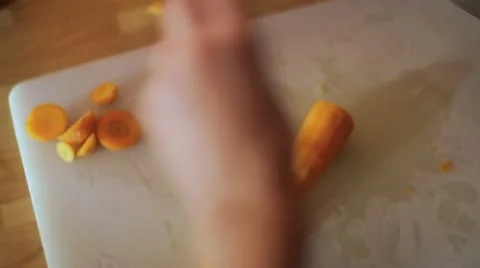 Cutting Carrots in Kitchen Stockbeeldmateriaal 11647750