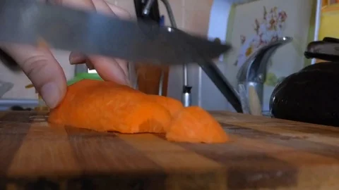 Cutting carrots into slices chef Stock Footage 93646491