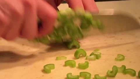 Cutting Celery in Kitchen of Restaurant Video stock 82211535