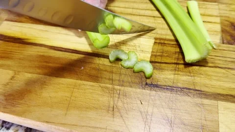 Cutting celery for a Lasagna Stock Footage 335758755