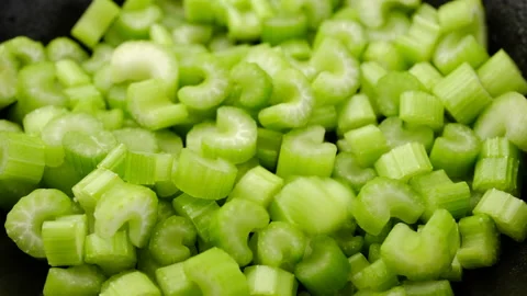 Cutting celery in plate sprinkle and rotate Stock Footage 207456643