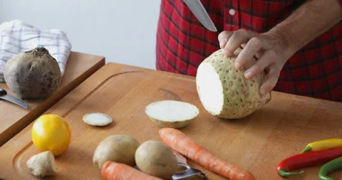 Cutting celery root into slices, close up Stock Footage 146243302