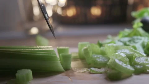 Cutting celery using kitchen knife on wooden board, Fresh healthy celery for 스톡 동영상 148241366