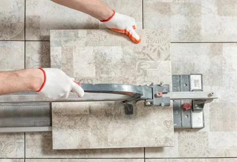 Cutting a ceramic tile. Stock Photos