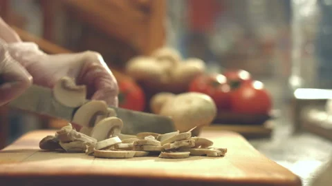 Cutting champignons on a cutting board. Video stock 86705498