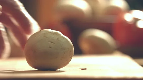 Cutting champignons on a cutting board. Видео 86706236