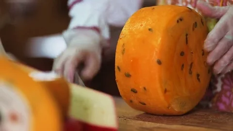 Cutting cheese with knife Stock Footage 69221564