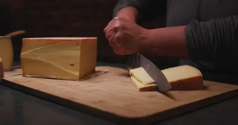 Cutting Cheese Wedge in Slow Motion Video stock 274774336