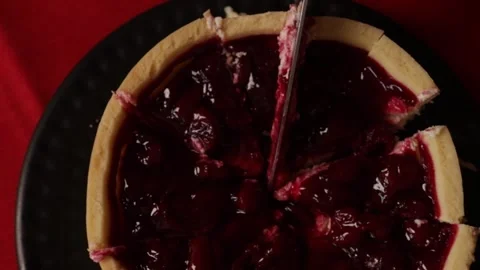 Cutting cherry pie, serving tasty cheesecake, red fruit treat Stock Footage 289549632