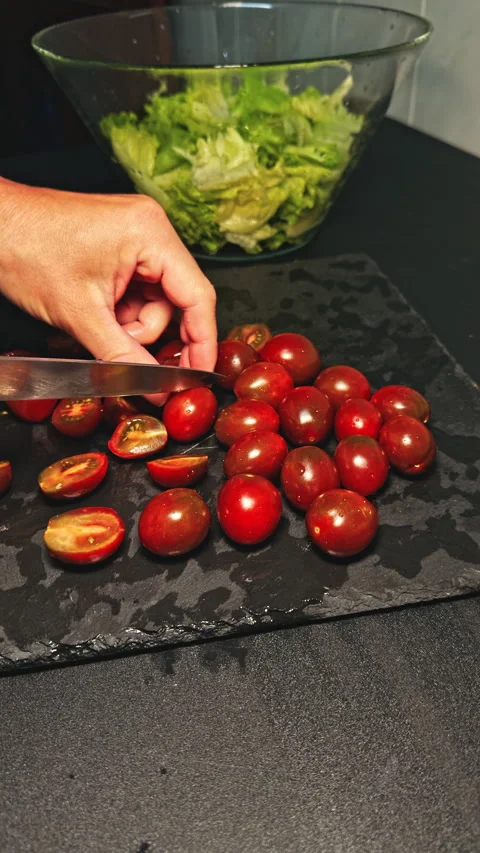 Cutting Cherry Tomatoes hand knife Stock Footage 277104142