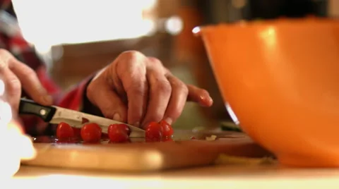 Cutting up Cherry Tomatoes   for a Salad Stock Footage 58614959