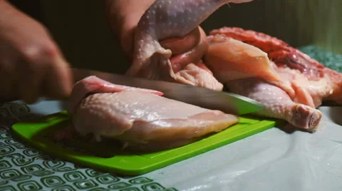 Cutting a chicken on a board Stock Footage 62971073