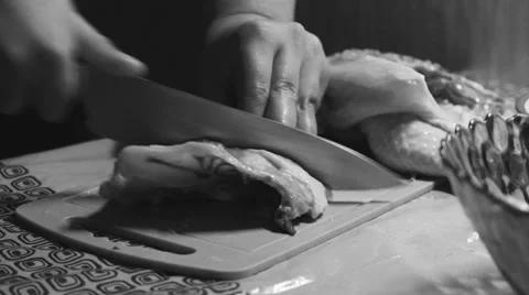 Cutting a chicken on a board Stock Footage 62983286
