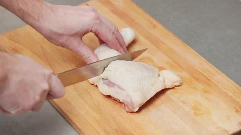 Cutting a chicken on a board Stock Footage 232812144