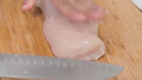 Cutting chicken breast Stock Footage 128446532