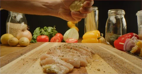 Cutting chicken fillets with chef knife macro shot Stock Footage 126288736