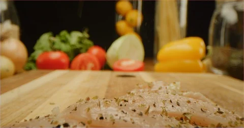 Cutting chicken fillets with chef knife macro shot Stock Footage 126289296