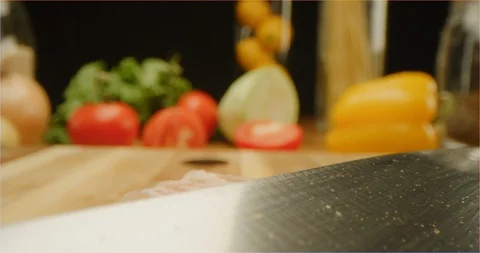 Cutting chicken fillets with chef knife macro shot Stock Footage 126289347
