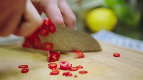 Cutting chili pepper Stock Footage 234996133