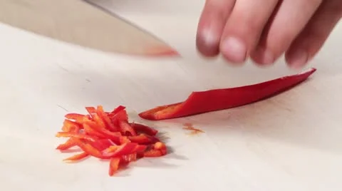 Cutting a chilli into thin strips Video stock 24673212