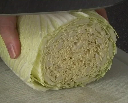 Cutting Chinese cabbage Stock Footage