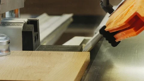 Cutting chipboard at 45 degrees on professional equipment. Close-up Stock Footage 106727007